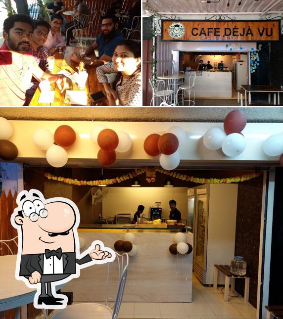 Take a seat at one of the tables at Cafe Déjà Vu SB