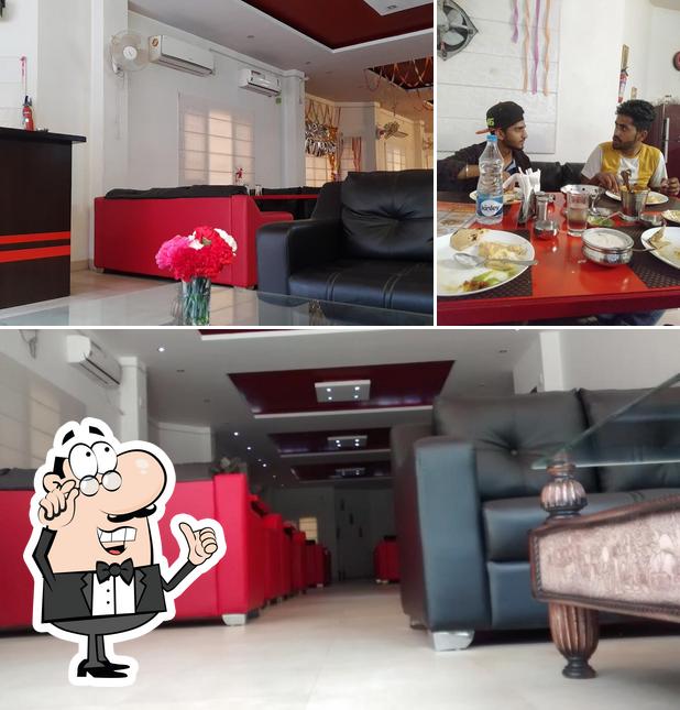 The image of interior and dining table at Meera Mahal Family Restaurant