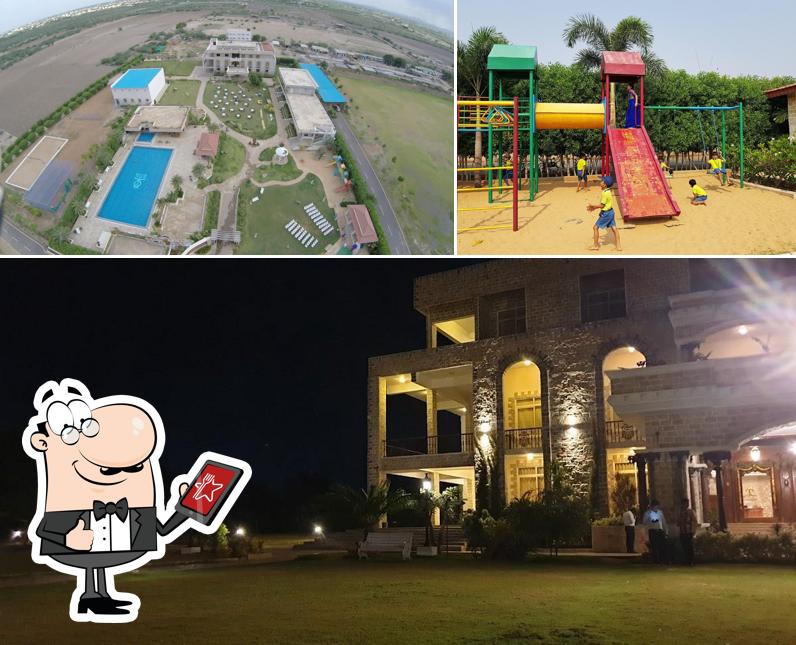 Check out the picture depicting exterior and play area at Royal County