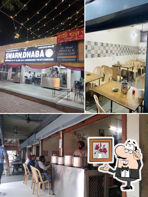 Take a seat at one of the tables at Swarn Dhaba