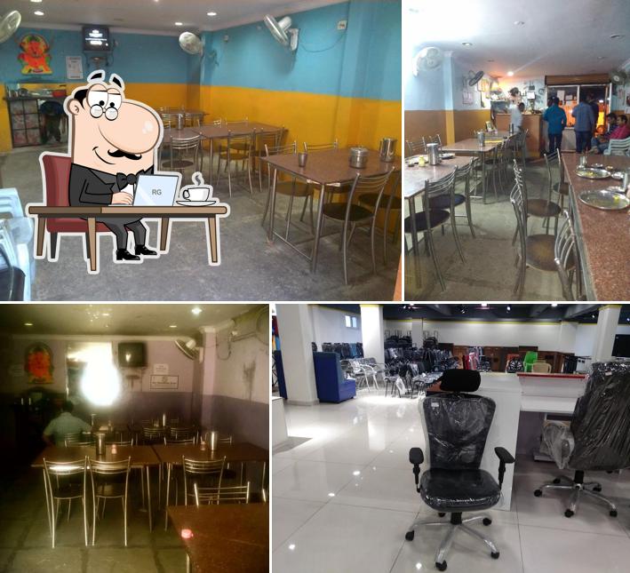 Take a seat at one of the tables at Thambi Biryani House