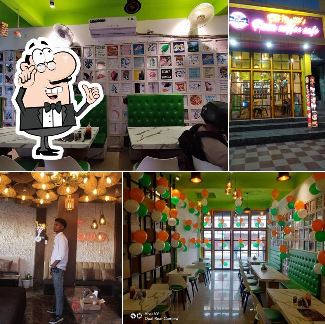 Take a seat at one of the tables at The Matto's Pizza Coffee Cafe