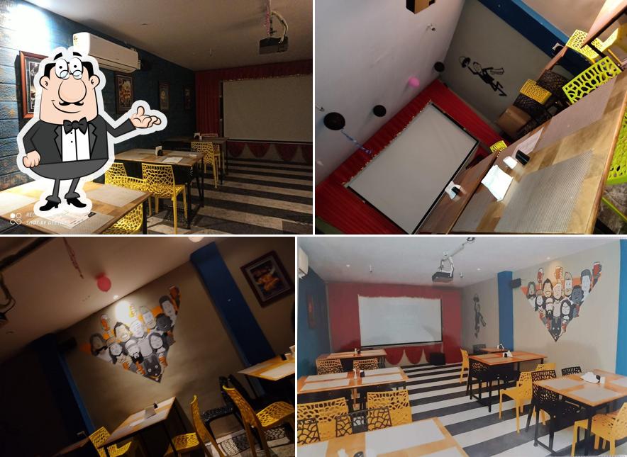 Take a seat at one of the tables at Grill & chill cafe & Restaurant