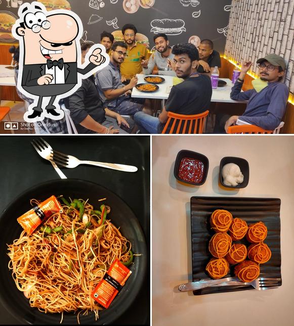 Take a look at the image displaying interior and food at Momo Nation Cafe