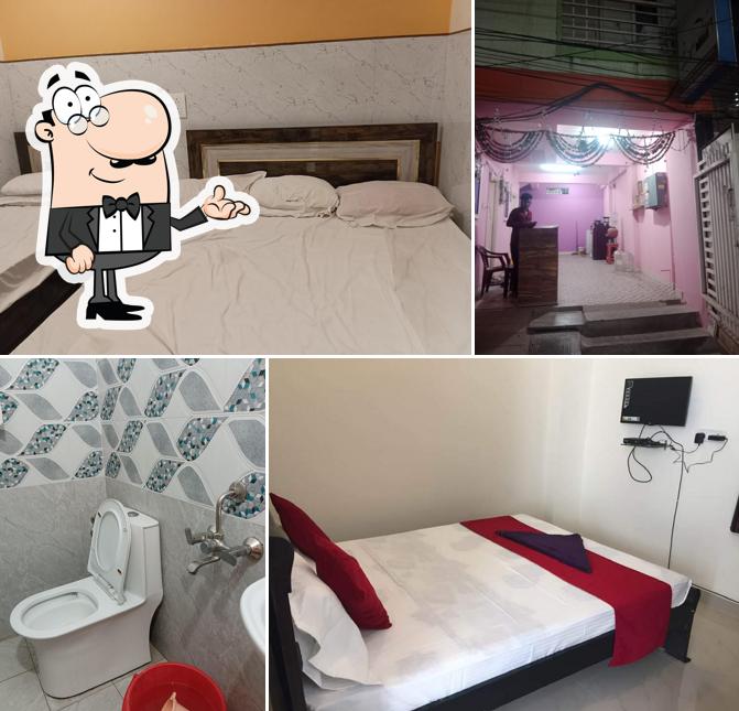 Take a seat at one of the tables at Nimantran hotel for bengali foods & accommodation