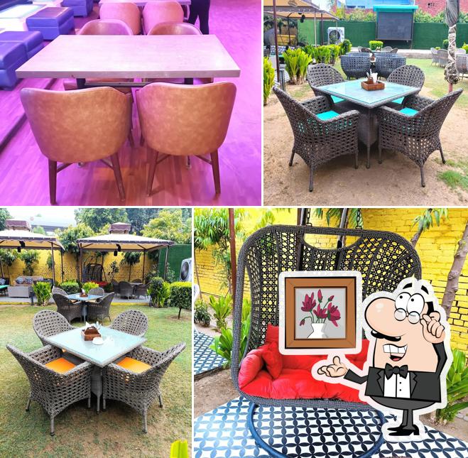 Take a seat at one of the tables at The Kohinoor Garden Bar & Lounge