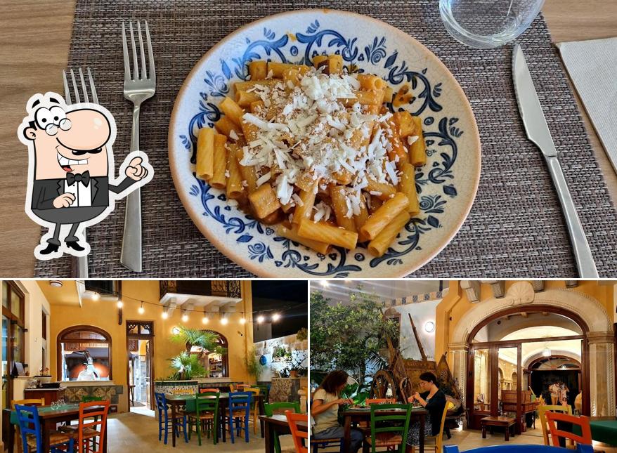 Guarda la foto che presenta la interni e cibo di Ristorante Pizzeria Cortile di Cerere