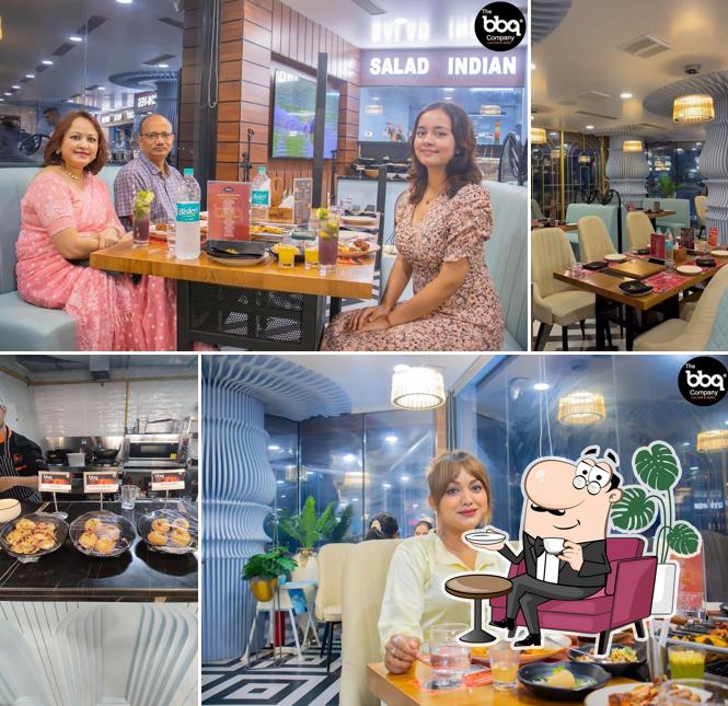 Take a seat at one of the tables at The Barbeque Company Guwahati Buffet Restaurant