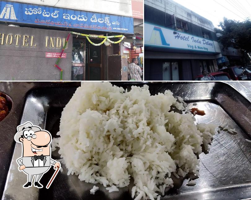 Check out the picture depicting exterior and food at Hotel Indu Deluxe