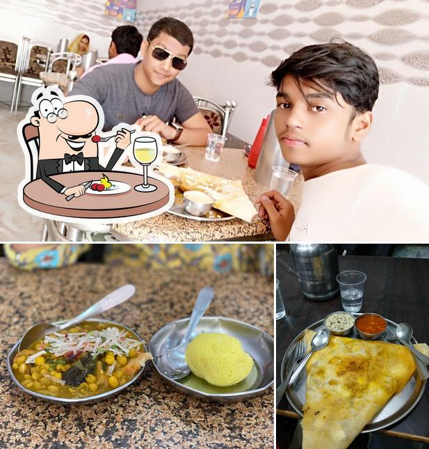 Take a look at the photo displaying food and interior at Aakash Ganga Restaurant And Sweet House