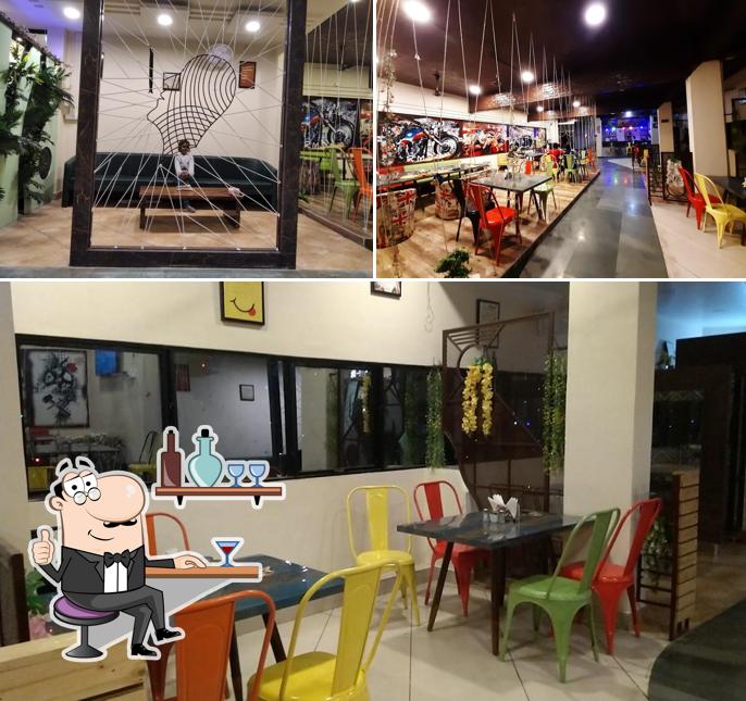 Take a seat at one of the tables at NH-44 Hotel & Restaurant