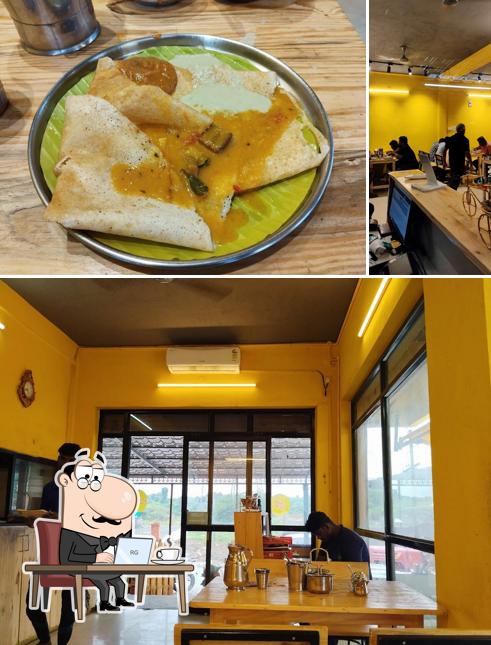 This is the image depicting interior and beverage at dosai kadai