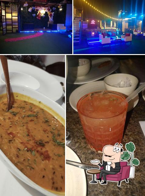 The photo of interior and food at Level 4 Rooftop Lounge