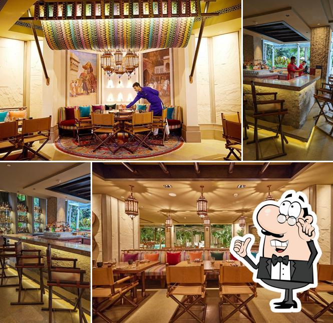 Take a seat at one of the tables at Loya - Taj West End, Bengaluru