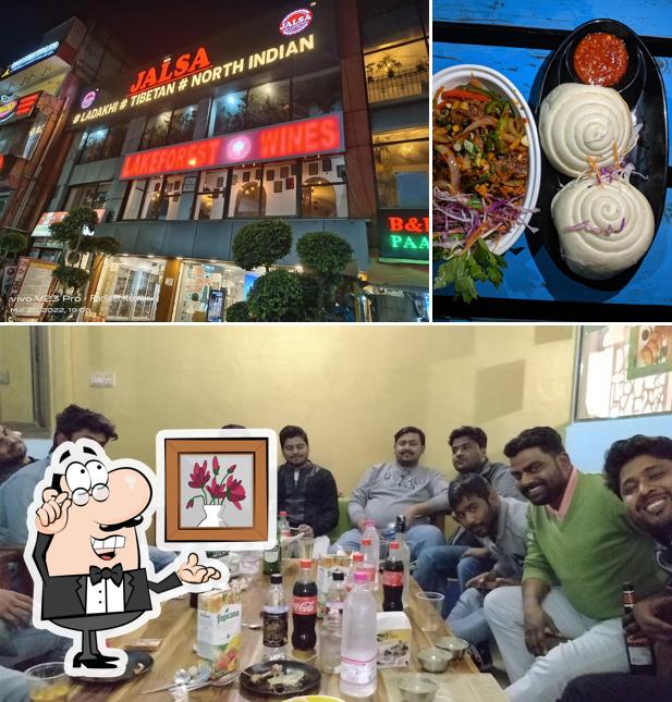 Take a seat at one of the tables at Jalsa Restaurant