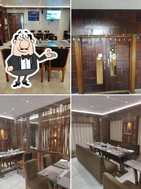 Take a seat at one of the tables at Daruchini Restaurant And Banquet