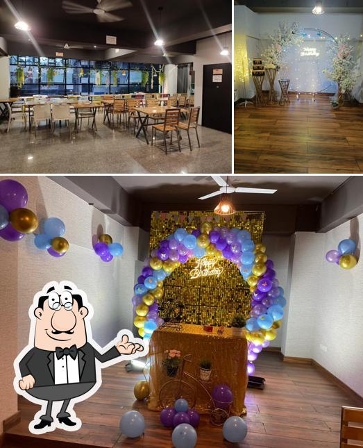 Take a seat at one of the tables at The Cinema Lounge by Fun Hats And Cafe