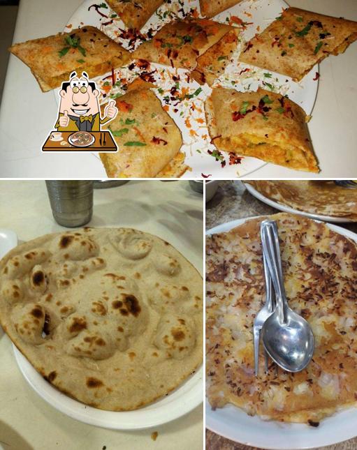 Try out pizza at Anand Bhuvan