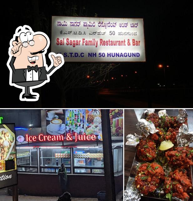 Take a seat at one of the tables at SAI SAGAR Family Restaurant