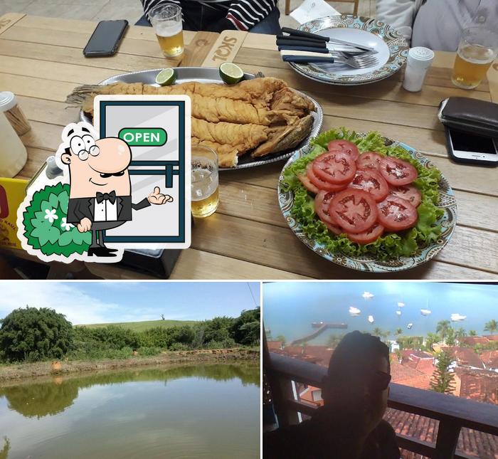 A imagem da exterior e comida no Bar do Raul