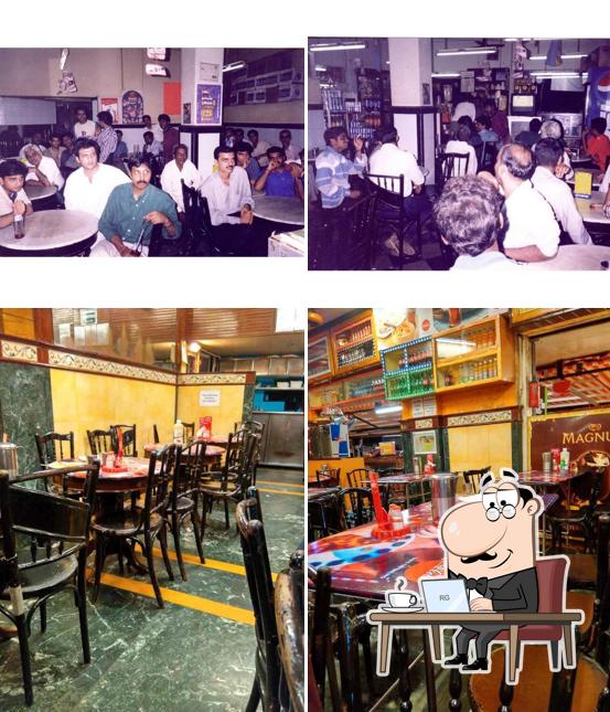 Take a seat at one of the tables at Cafe Gulshan
