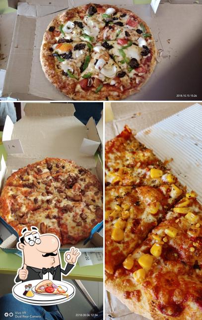 Pick pizza at Domino's Pizza café