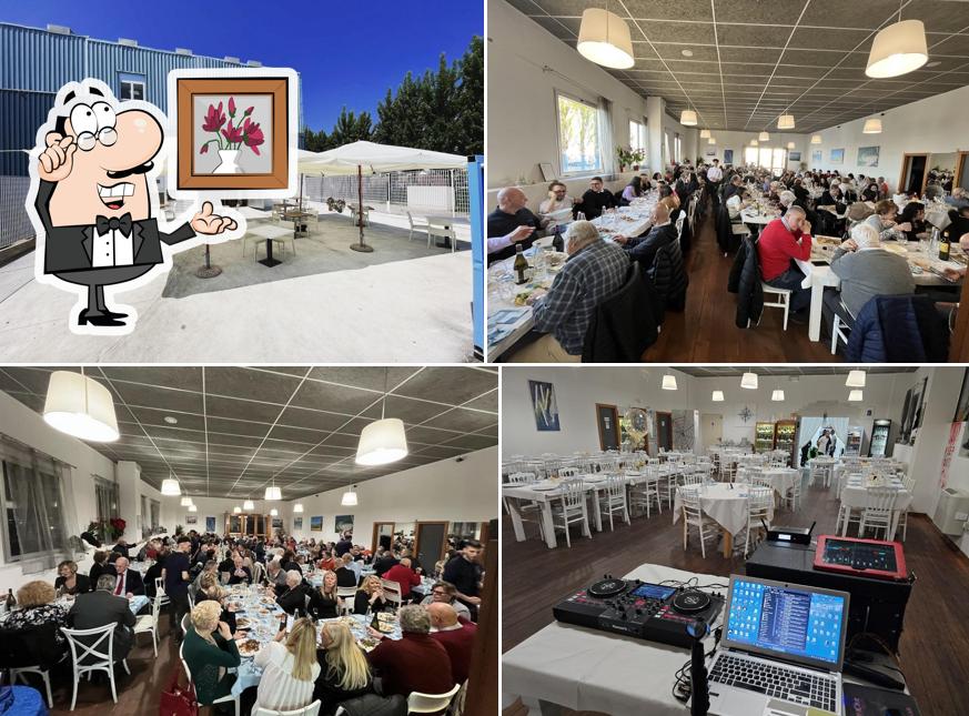 Siediti a un tavolo di Ristorante Amici Del Mare