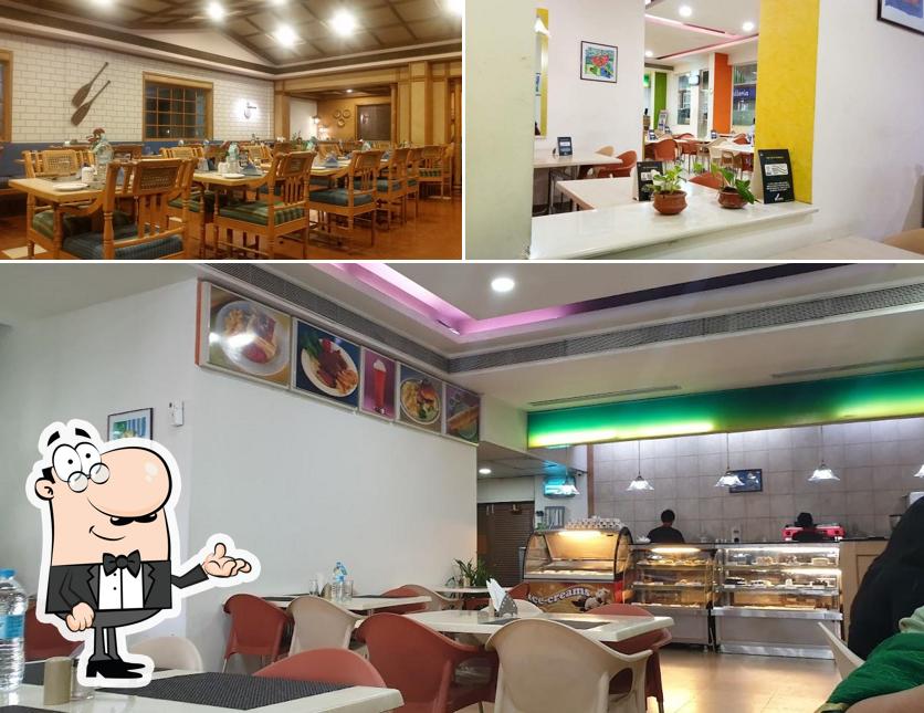 Take a seat at one of the tables at Cafe Canopy MG Road