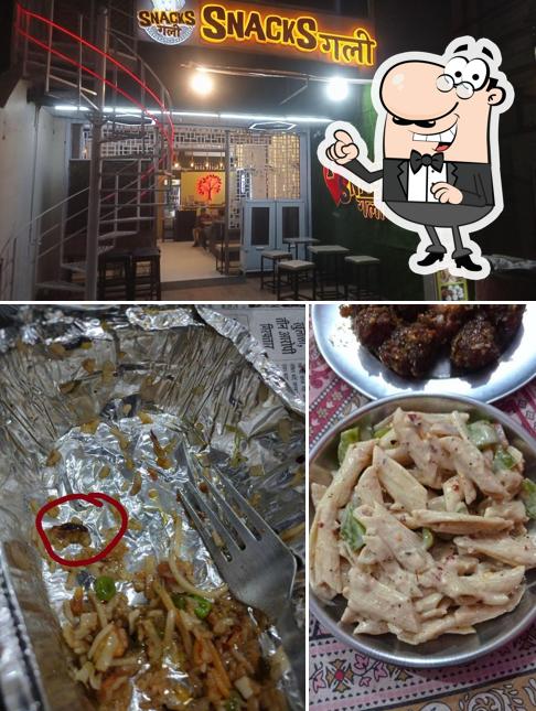 Among various things one can find interior and food at SNACKS Gali The Best restaurant