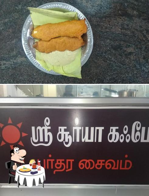 Order a burger at Sri Suryaas Cafe