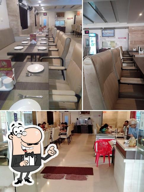Take a seat at one of the tables at Ganapati Family Restaurant Vishakhapatnam