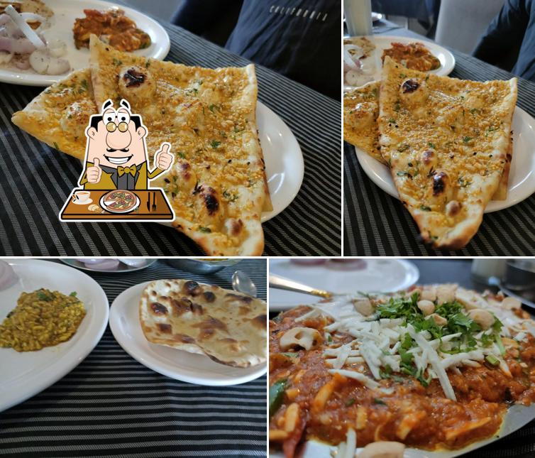 Order pizza at Neelkanth Restaurant