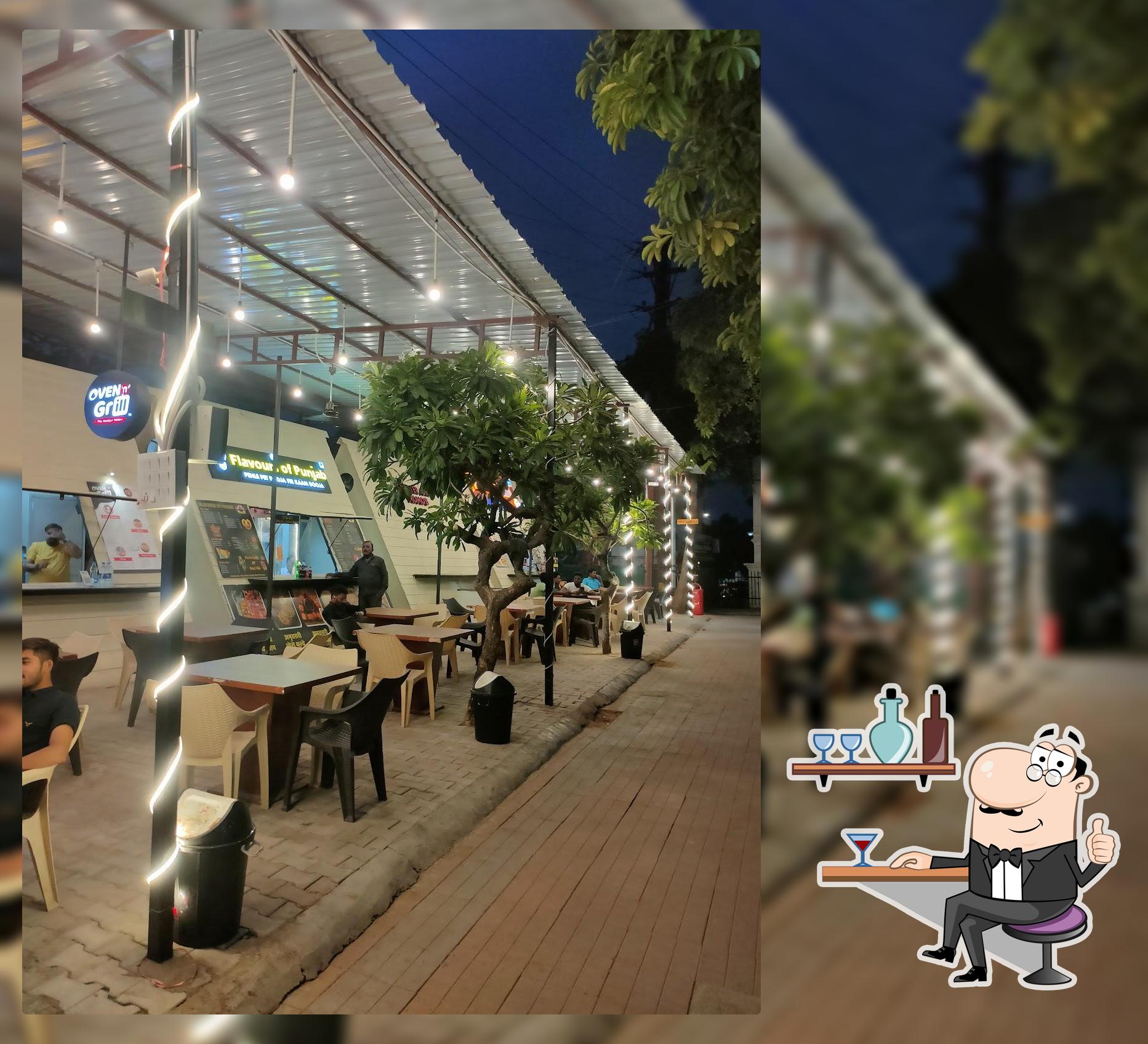 Take a seat at one of the tables at Khaau Gali - Aao Humari Gali