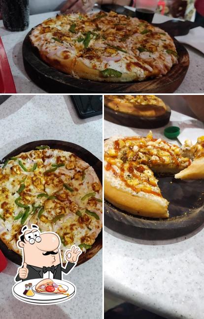 Get pizza at Laziz Pizza Gohana