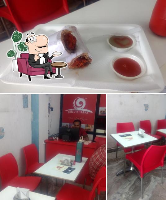 This is the picture depicting interior and food at Roll's Cafe Amaroli