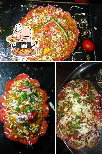 Try out pizza at Sree Punjabi Dhaba (pure vegetarian)