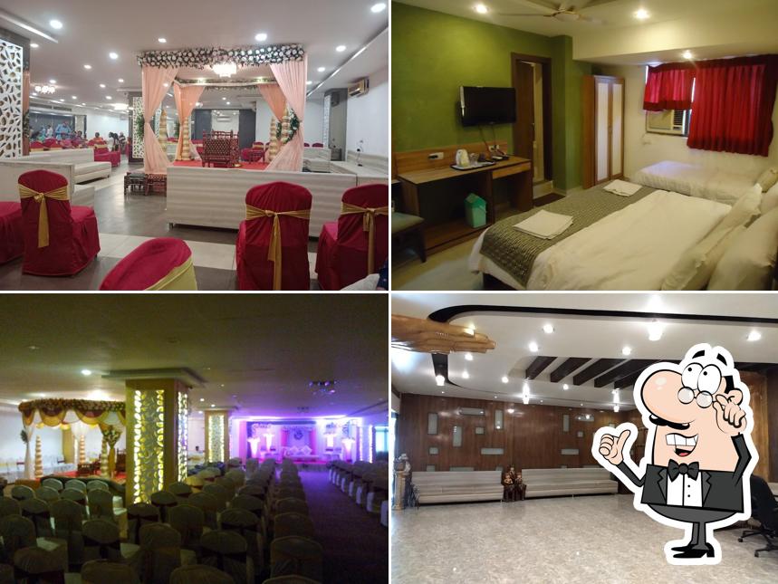 Take a seat at one of the tables at Hotel Maan Residency Restaurant & Banquets - Best Budget Hotel Hotels Banquet Halls in Ahmedabad