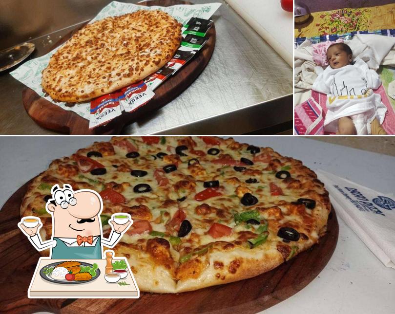 This is the image showing food and interior at Oscann Pizza