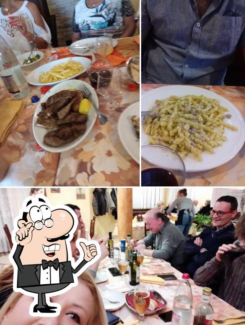 Siediti a un tavolo di Ristorante pizzeria le betulle