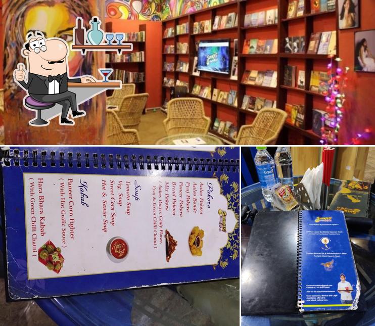 Take a seat at one of the tables at Sheroes Hangout Cafe