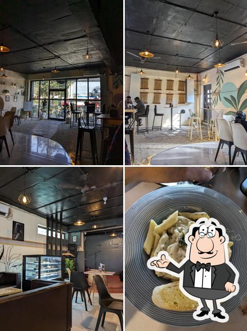 Take a seat at one of the tables at lifafa cafe & bistro