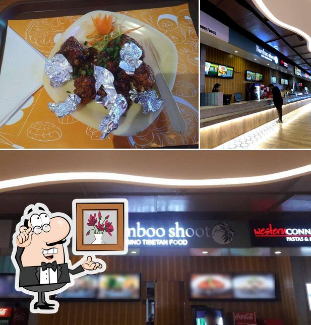 Take a look at the picture showing interior and dining table at Bamboo Shoots