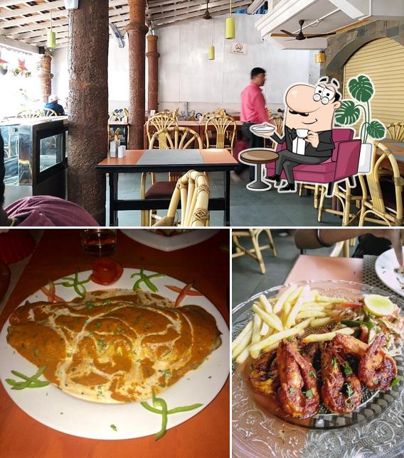 Take a seat at one of the tables at Foodland Multi Cuisine & Bars