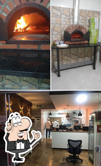 O interior do Pizzaria Serra Verde