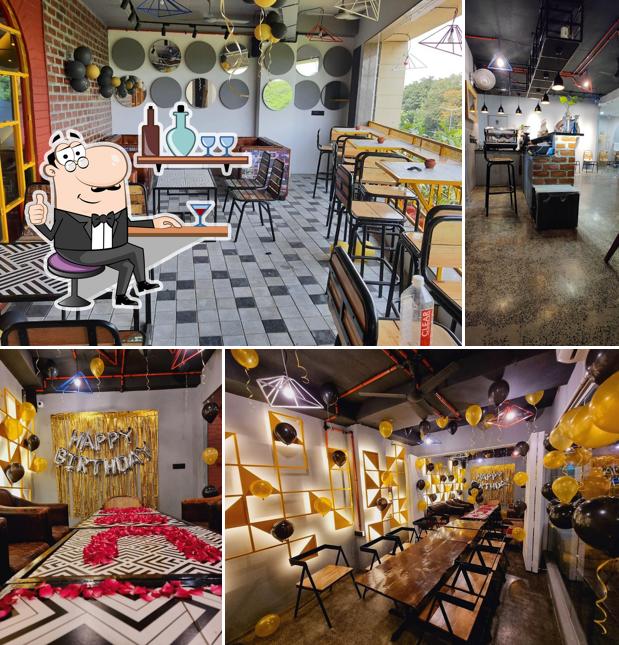 Take a seat at one of the tables at Times Cafe Manjalpur