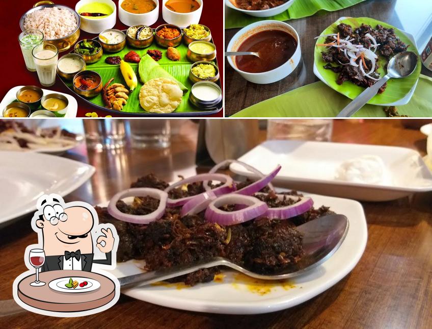 The photo of Kumar Cafe’s food and dining table