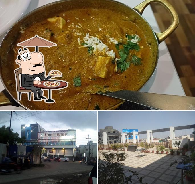 The image of exterior and food at Palkhi RoofTop Veg Restaurant