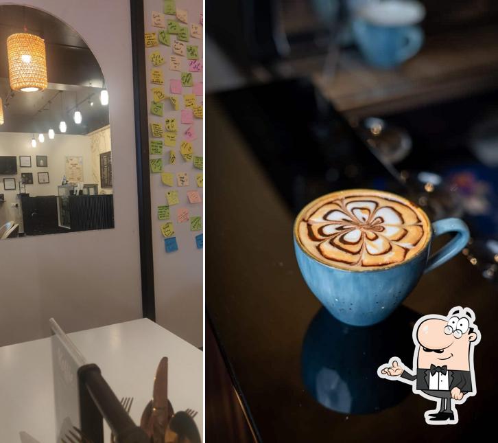 Take a seat at one of the tables at Koffie The Restro Cafe