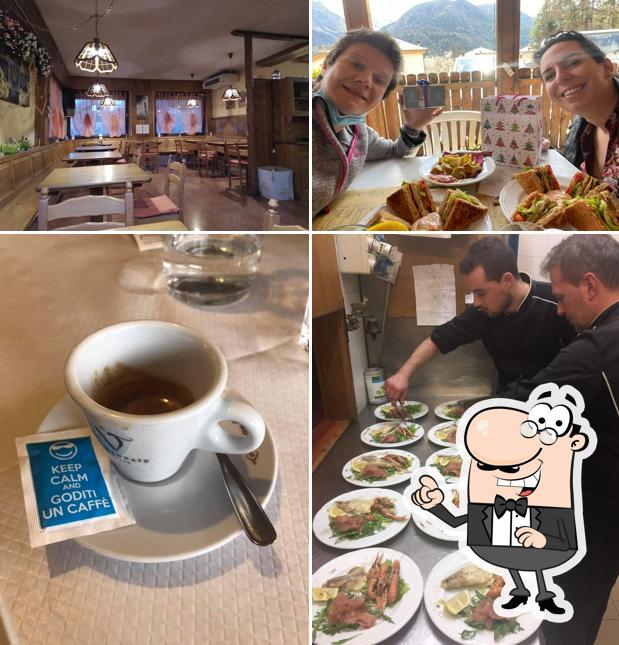 Questa è la immagine che presenta la interni e cibo di Henry Bar