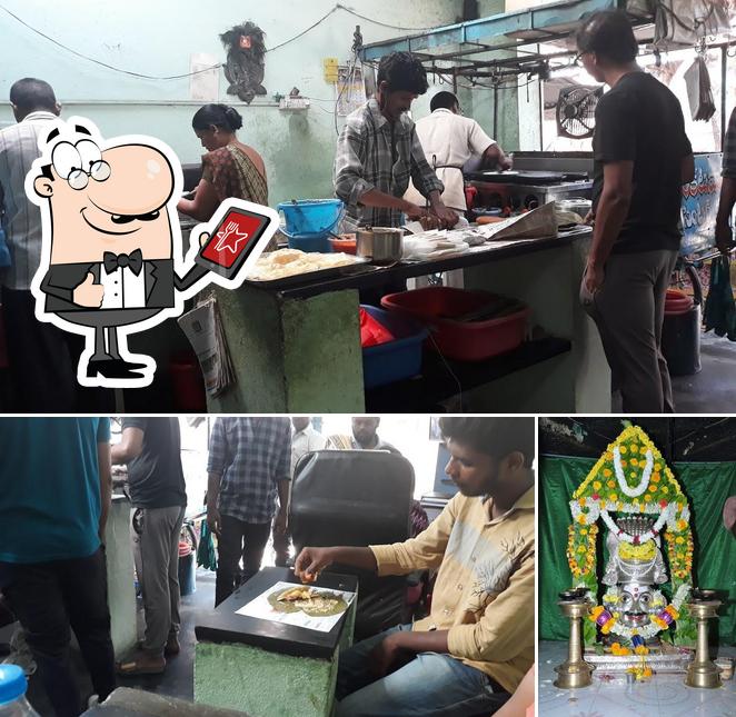 Take a look at the image displaying exterior and interior at Venkata Vasavi Tiffin Centre